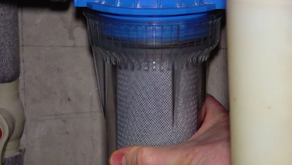 Still Image of Plumber Is Changing The Water Filter 